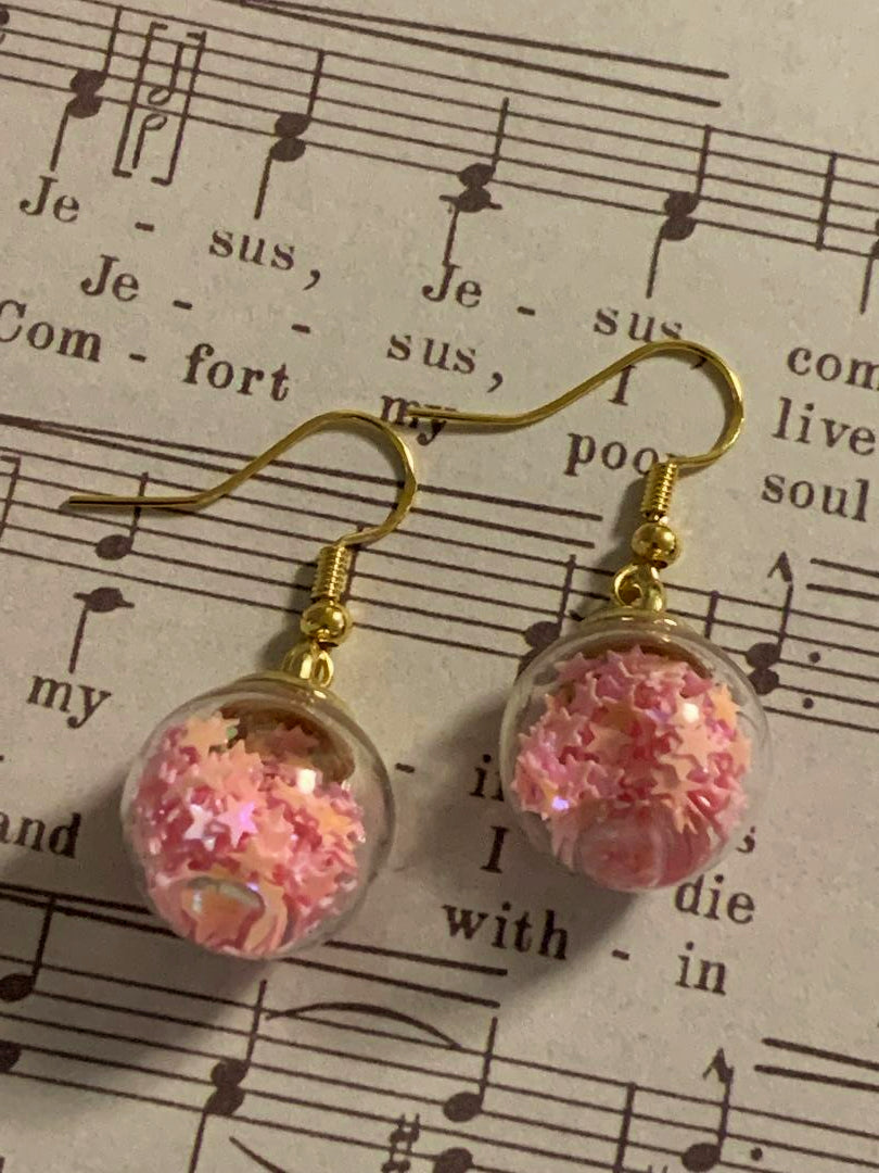 Pink stars in a ball
